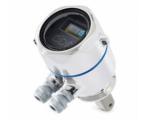 Chrome digital pressure transmitter with two cable gland ports and a mounting foot, front display showing readings.