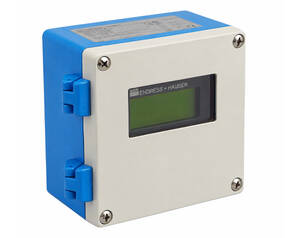 Compact blue and white Endress+Hauser process instrument with a small LCD display and four corner screws