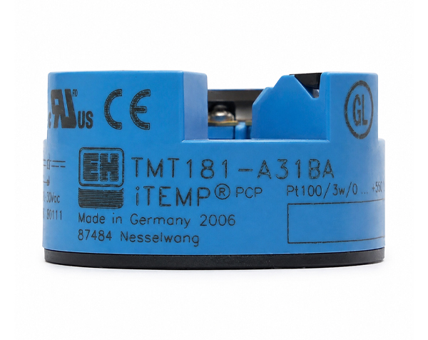 tmt181 — DERAAK Blue cylindrical industrial sensor component with black base, showing markings like TMT181-A31BA, Made in Germany 2006, and various certification logos.