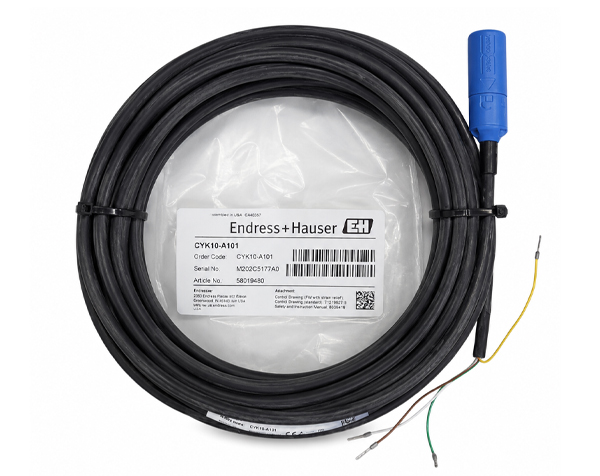 Coiled black industrial sensor cable with a blue connector and exposed yellow/green wires on a white background, ready for installation.