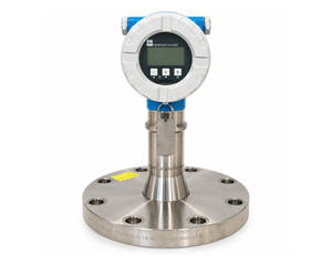 Industrial flow meter with circular digital display mounted on a stainless steel flanged connection.