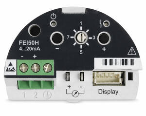 Circular black device module with green terminal block and a USB-style display port; shows FEI50H 4...20mA, plus/minus terminals, rotary dial, and warning symbol.