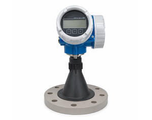Digital flow meter with blue housing and circular LCD display mounted on a flange base on a black support.