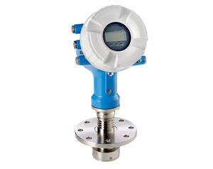 Industrial pressure transmitter with blue housing, white protective cap around a digital display, mounted on a flanged stainless‑steel connection.