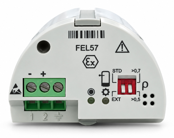 fel57-endress-hauser — DERAAK Electrical safety relay module with a green three-terminal block, minus/plus labels, and a red two-position switch with EX/STD markings.