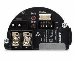 Close-up of a circular black electronic control module with screw terminals, two red Zero and Span buttons, a display connector, and calibration settings.