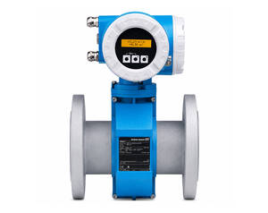 Inline flowmeter with blue body and round digital display mounted on a flanged pipe, showing control buttons and measurement screen for monitoring flow rate.