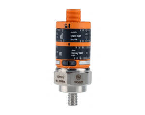 Adjustable industrial timing component with an orange and black dial, featuring delay and RMS scale markings and a threaded metal fitting at the bottom.